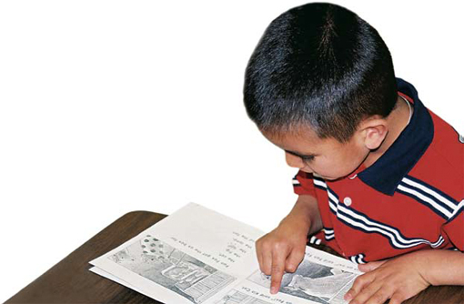 Photo of a young boy reading.