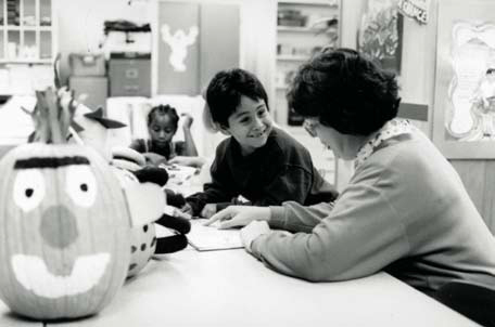 Photo of a teacher and student reading