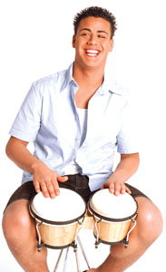 A photo of a man playing the drums.