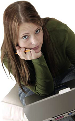 photo of a girl using a laptop computer